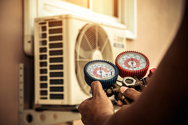 Professional Air Conditioning Service technician working in Ramsey, IN